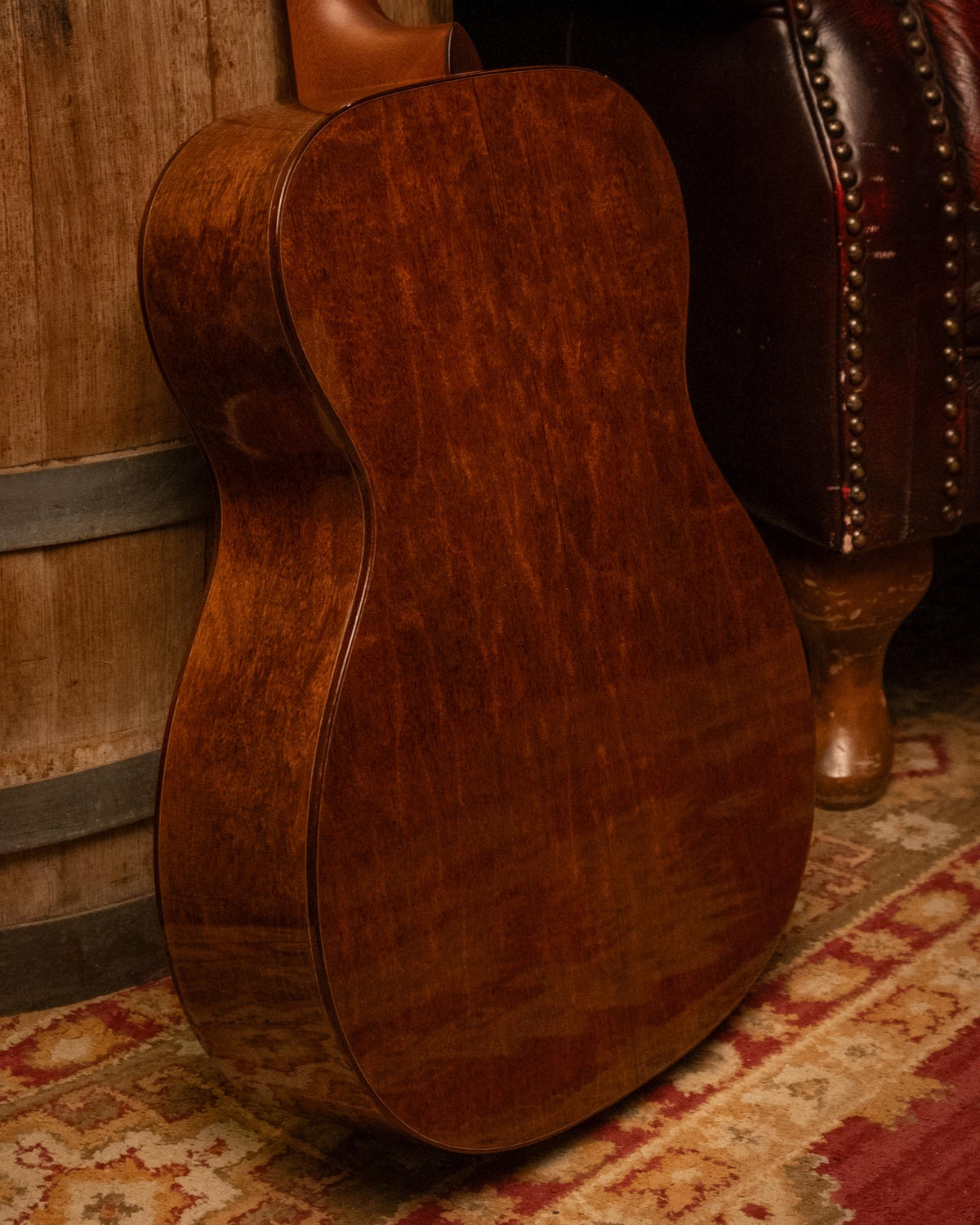 Martin OM-14 Sinker Redwood and Jaguar Claw Mahogany acoustic guitar, showing the body and wood grain details.