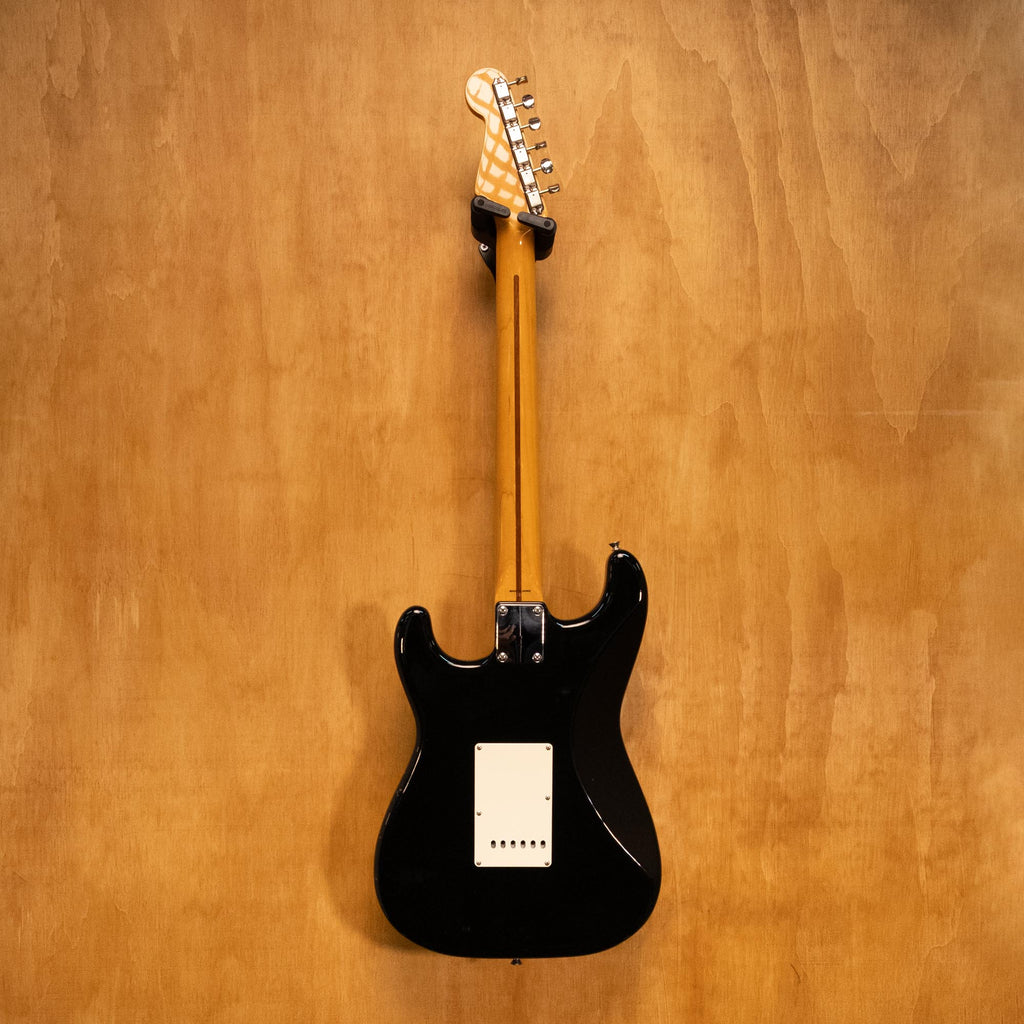 Fender Japan '57 Stratocaster electric guitar in black with maple neck and three single-coil pickups, shown from the front.