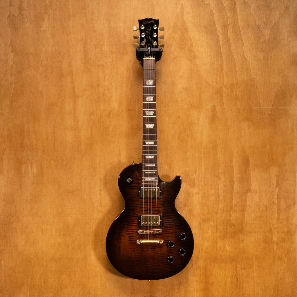 Gibson USA Les Paul Studio Plus electric guitar in Desert Burst finish, showing the body, neck, and pickups.