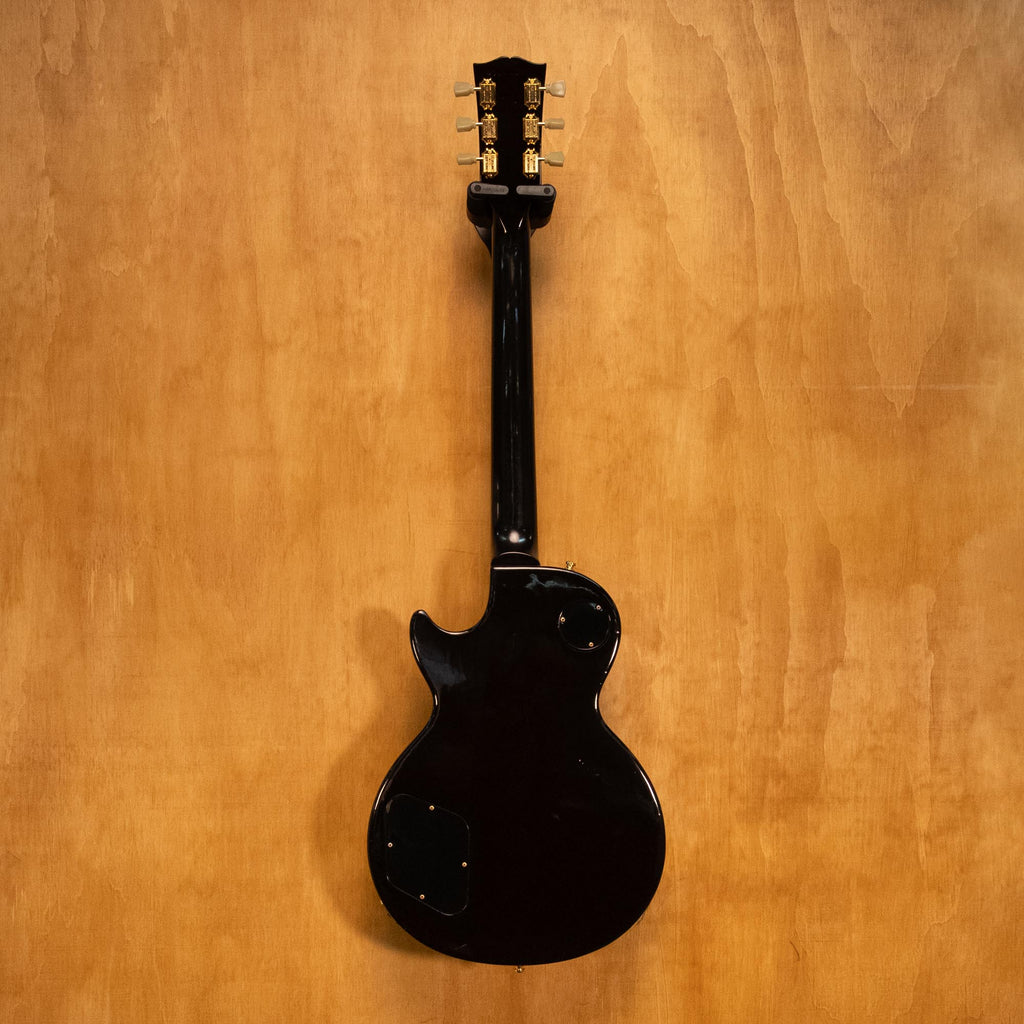 Gibson USA Les Paul Studio Plus electric guitar in Desert Burst finish with chrome hardware and carved top, photographed on a plain background.