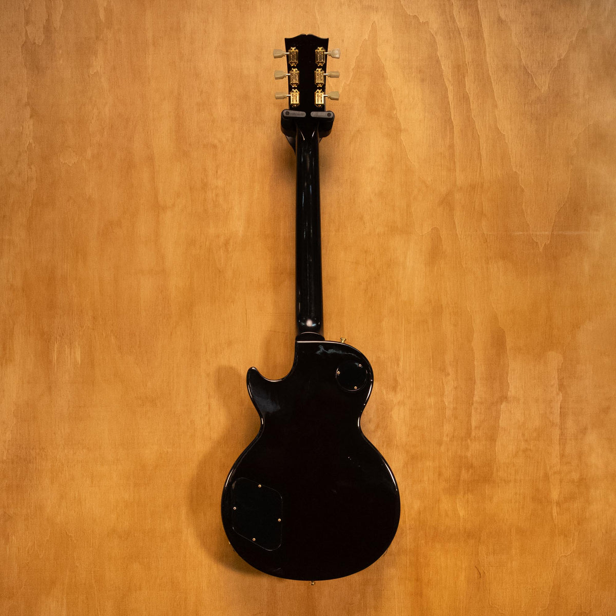 Gibson USA Les Paul Studio Plus electric guitar in Desert Burst finish with chrome hardware and carved top, photographed on a plain background.