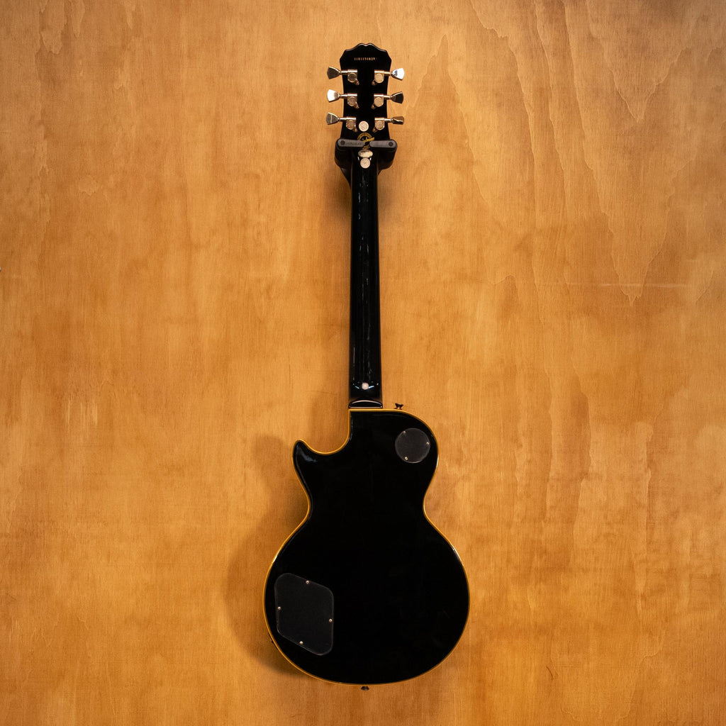 Epiphone LTD Les Paul Custom Classic electric guitar in antique ebony with gold hardware and dual humbucker pickups.