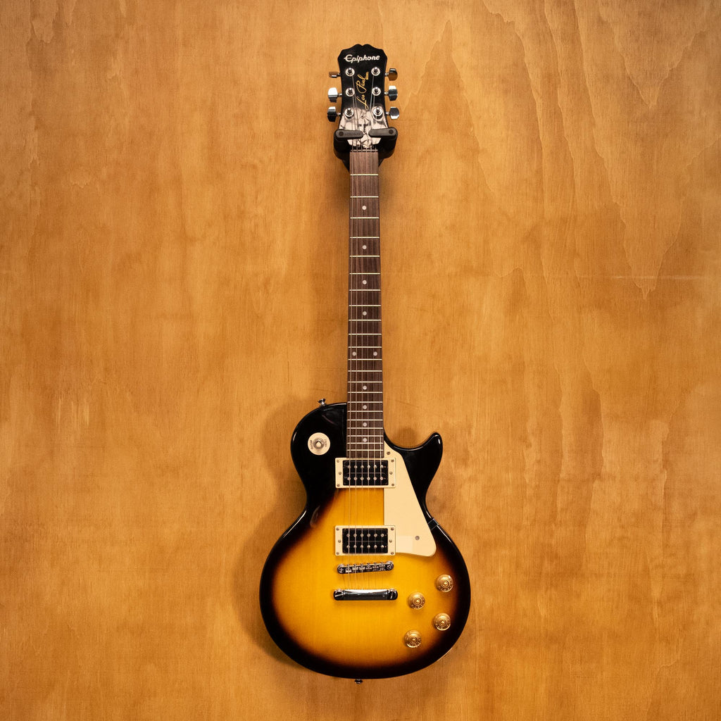 Epiphone Les Paul 100 electric guitar in vintage sunburst finish, showing the body, neck, and pickups.