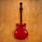 Epiphone Riviera Reissue electric guitar in cherry finish, showcasing its body, neck, and hardware details.