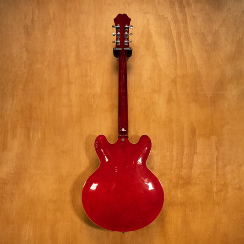 Epiphone Riviera Reissue electric guitar in cherry finish, showcasing its body, neck, and hardware details.
