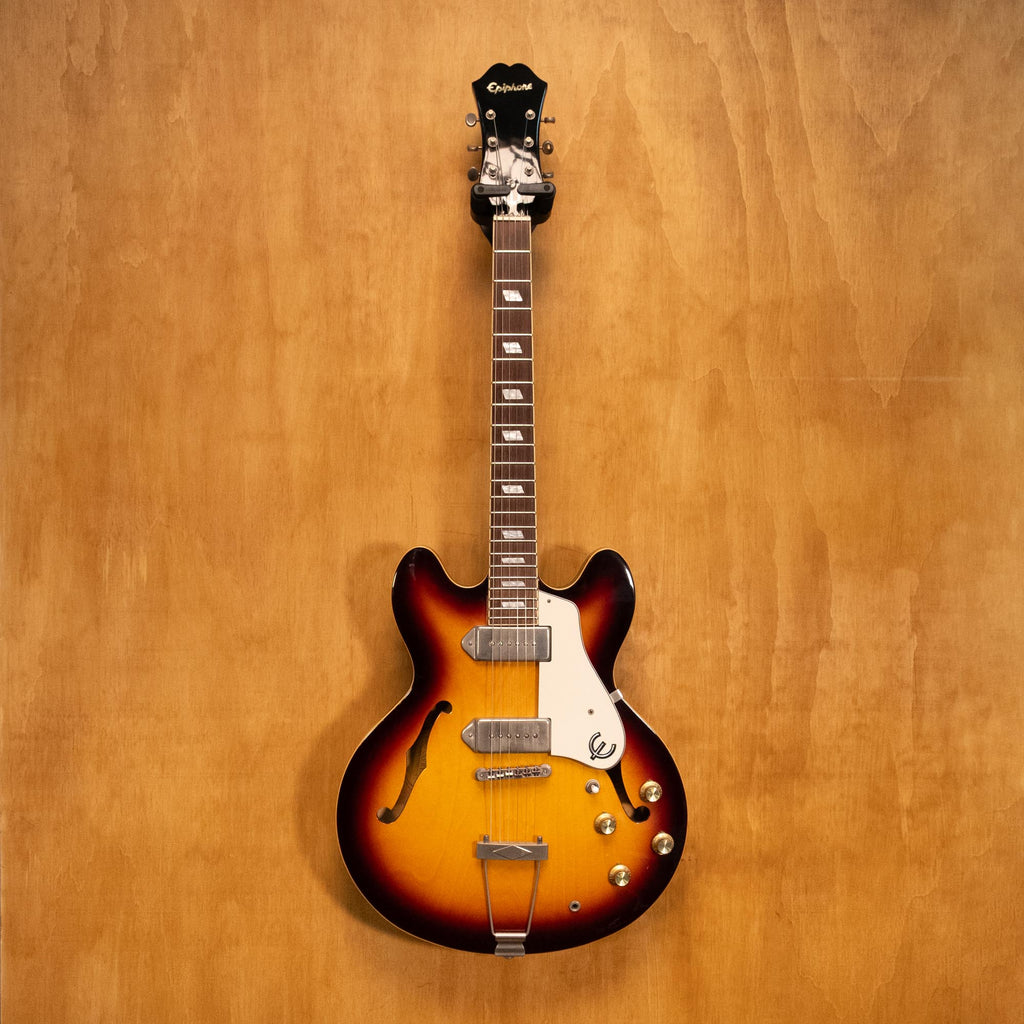 Epiphone Casino electric guitar in vintage sunburst finish, showcasing its hollow body, f-holes, and classic design.