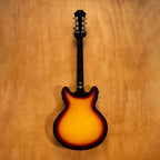 Epiphone Casino electric guitar in vintage sunburst finish, showcasing its hollow body and classic design.