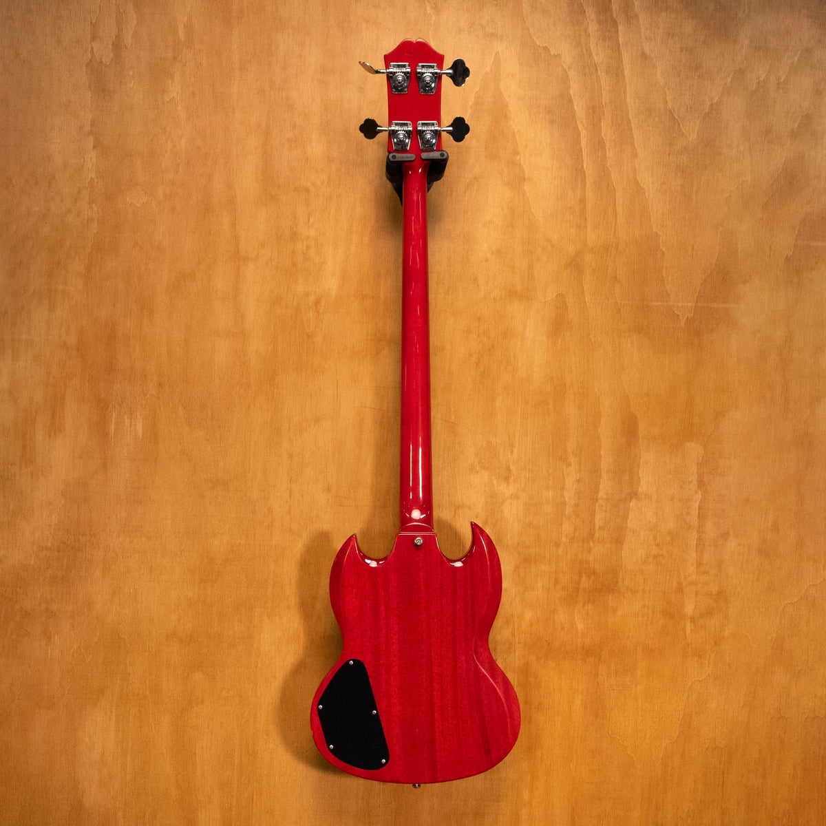 Preloved Epiphone EB-3 SG bass guitar in cherry finish, with four strings and vintage-style controls, displayed on a stand.