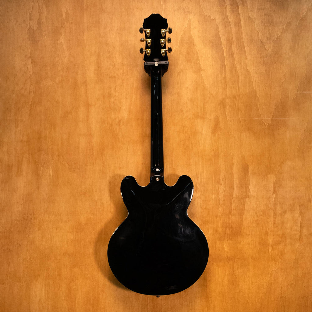 Epiphone Sheraton II electric guitar in ebony finish, showcasing double-cutaway body, humbucker pickups, and chrome hardware.