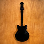 Epiphone Sheraton II electric guitar in ebony finish, showcasing double-cutaway body, humbucker pickups, and chrome hardware.