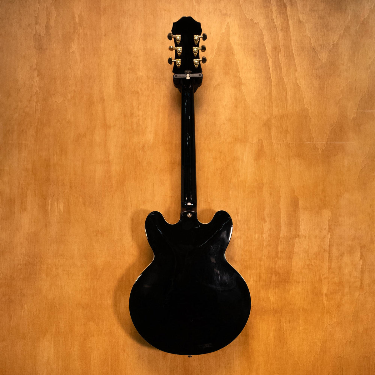 Epiphone Sheraton II electric guitar in ebony finish, showcasing double-cutaway body, humbucker pickups, and chrome hardware.