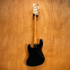 System Craft Mod Fretless Jazz Bass Guitar in black, showcasing its sleek body and fretless fingerboard, pre-owned and in excellent condition.
