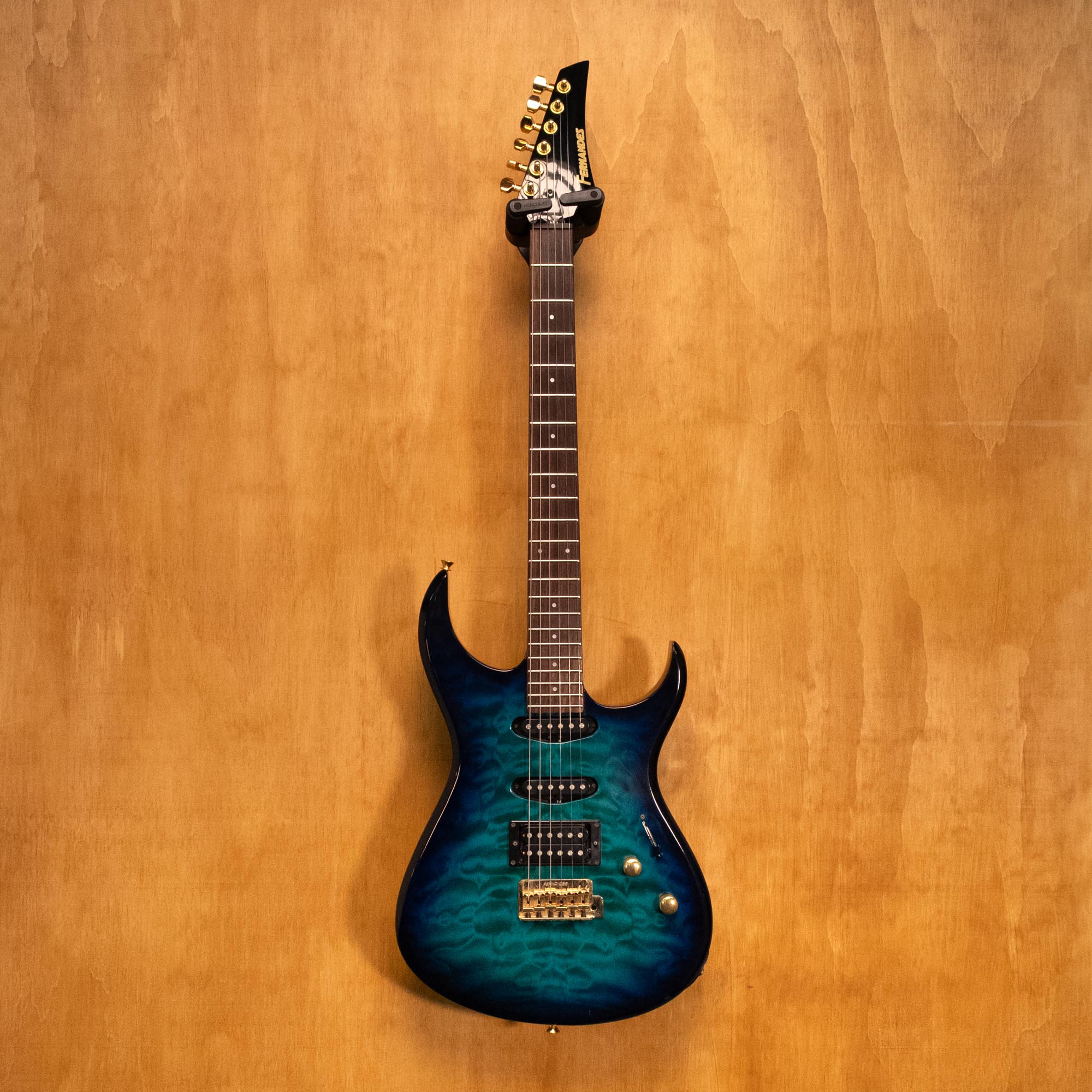 Fernandes FGZ-420 electric guitar MIJ with sunburst finish, solid body, and six-string design, shown from a front angle.