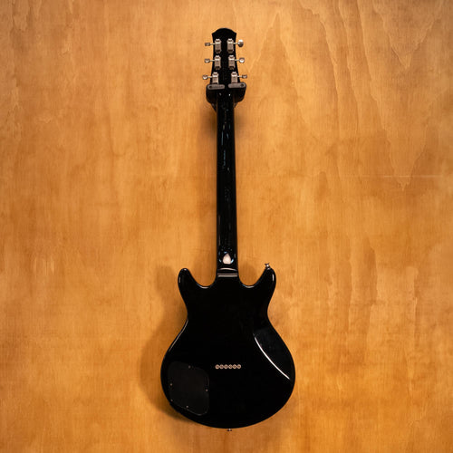 Yamaha SG-RR electric guitar in standard black with double-cutaway design, shown on a stand against a plain background.