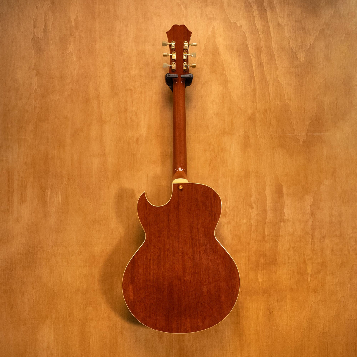 Epiphone Zephyr Regent electric guitar in natural finish, showcasing its vintage-style body and dual humbucker pickups.