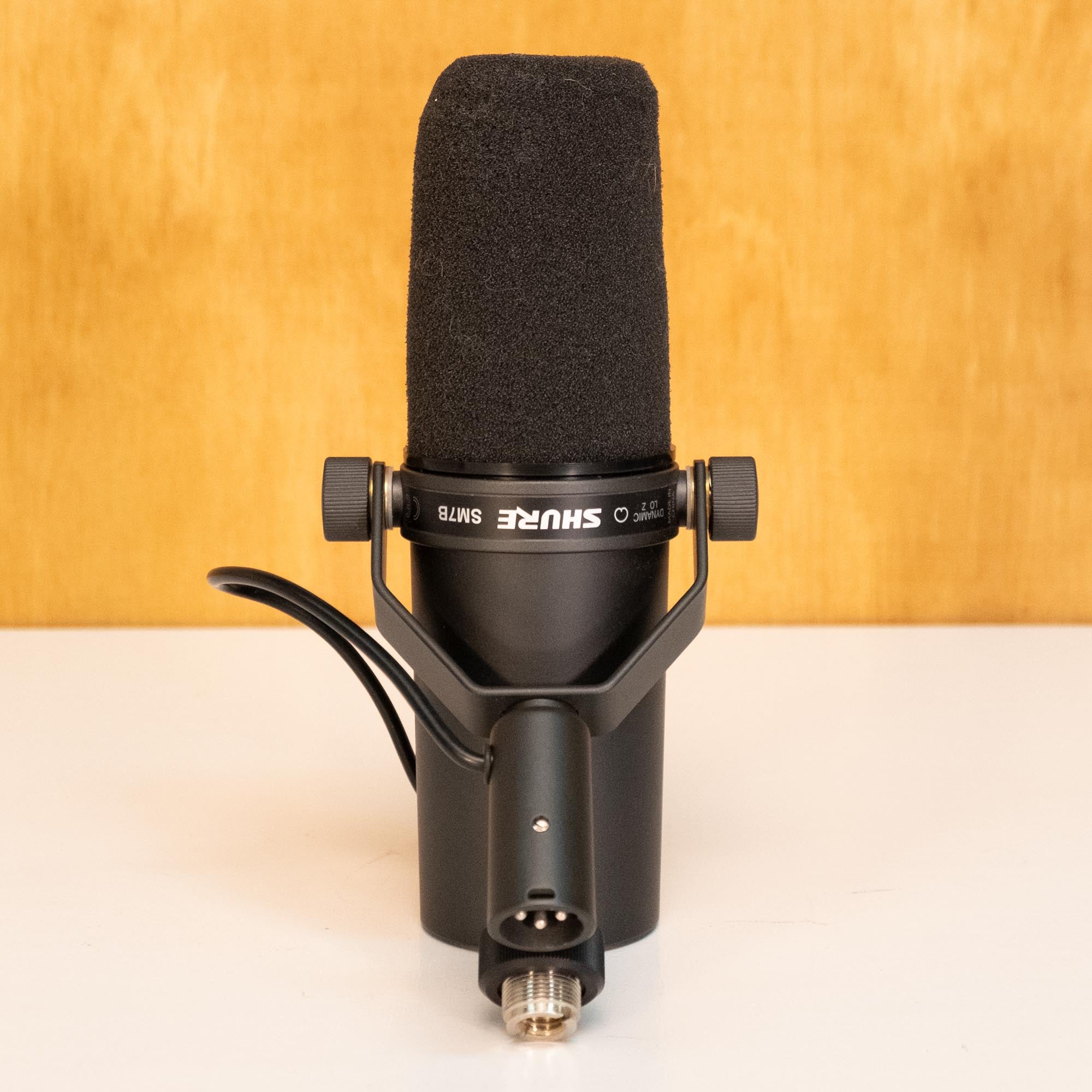 Preloved Shure SM7B dynamic vocal microphone on a stand, studio microphone for broadcasting and recording.