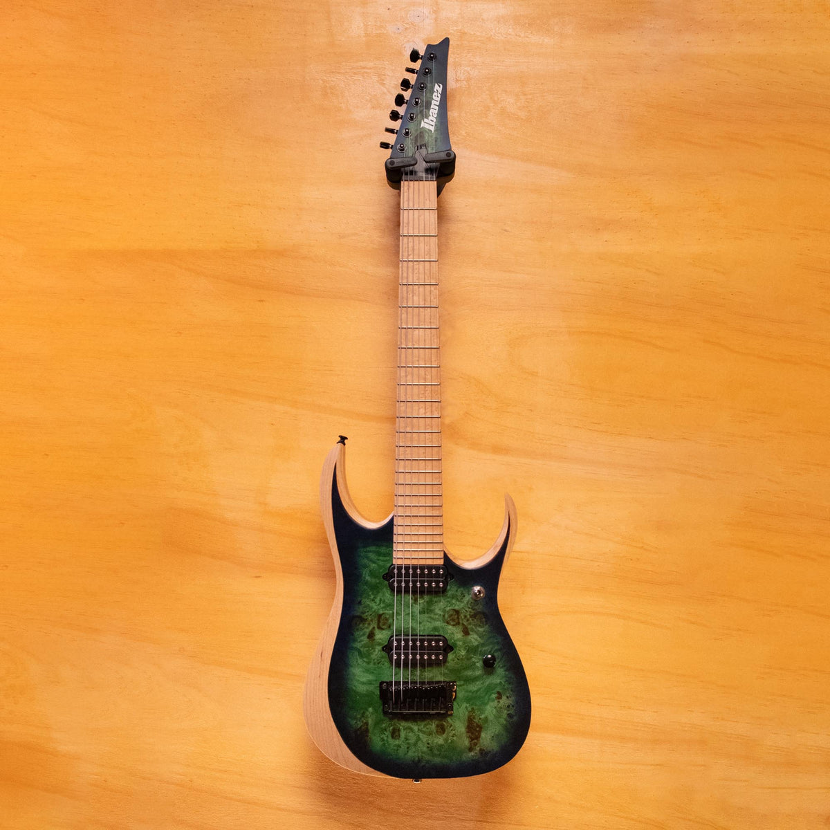 Ibanez Iron Label RGDIX7MPB electric guitar with multi-colored finish, six-string body, and sleek design.