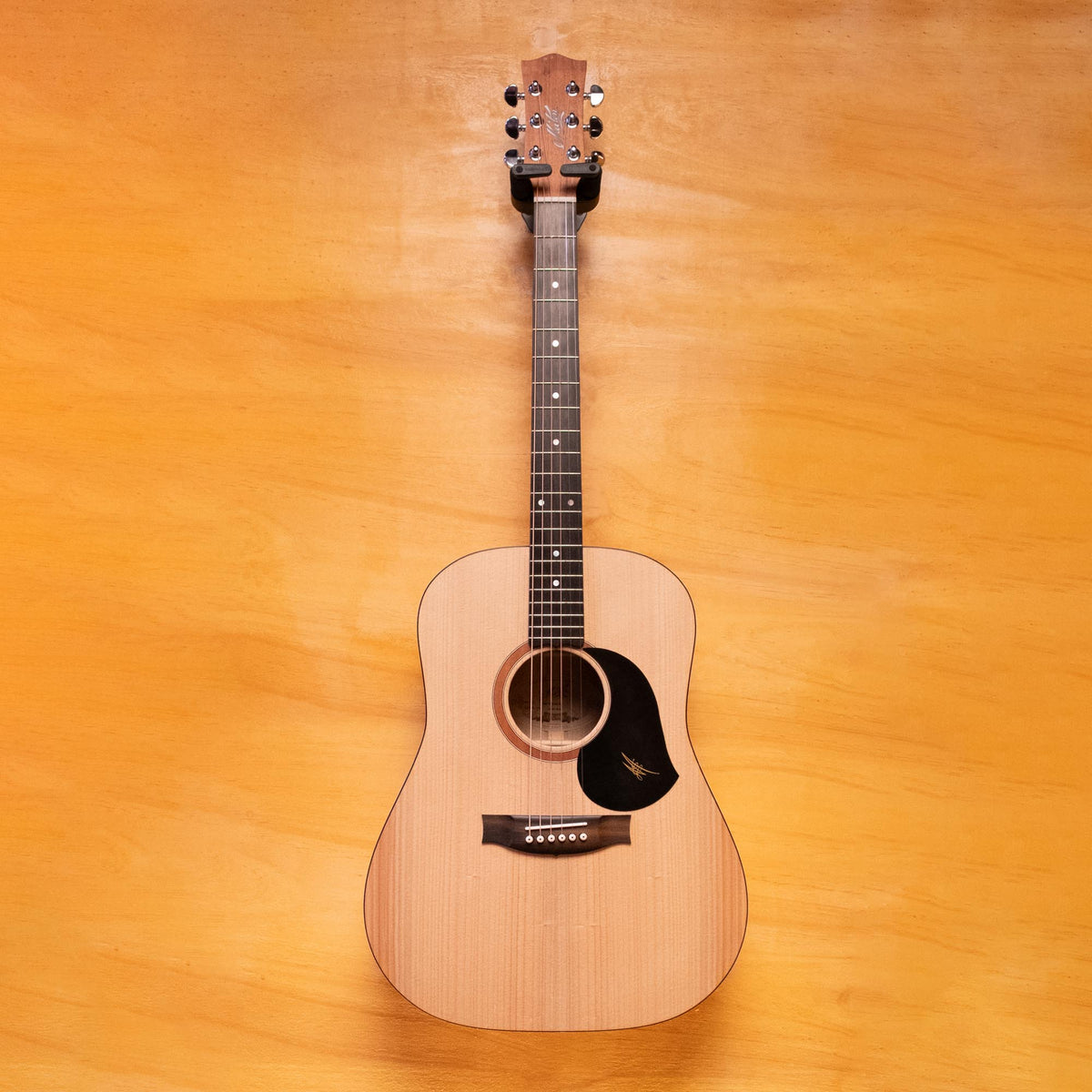 Maton S60 acoustic guitar with a natural wood finish, showing the body, neck, and strings in a close-up shot.