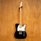 Fender '70s Telecaster TL71 electric guitar in black with maple neck, made in Japan, shown on a stand.