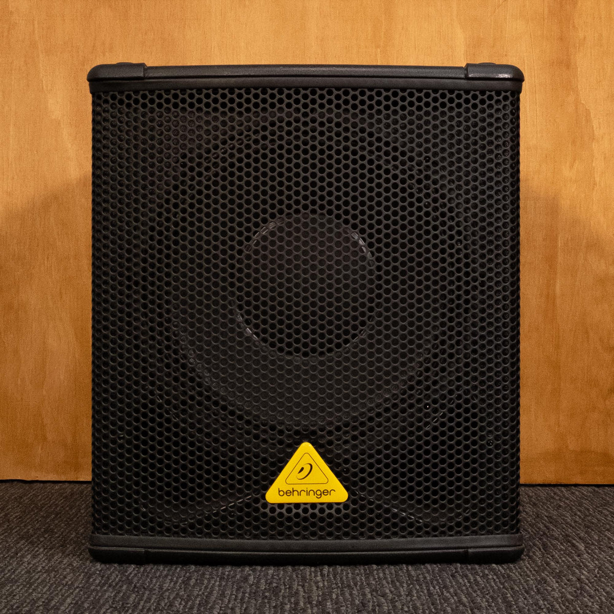 Behringer B1200-D Pro powered subwoofer with control panel and speaker grille, used condition.