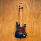 Blue Reco Guitars S-Style electric guitar with a sleek body and chrome hardware, displayed on a stand.