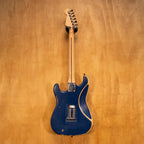 Reco Guitars S-Style electric guitar in blue, showcasing a sleek body, chrome hardware, and classic design, preowned and ready to play.