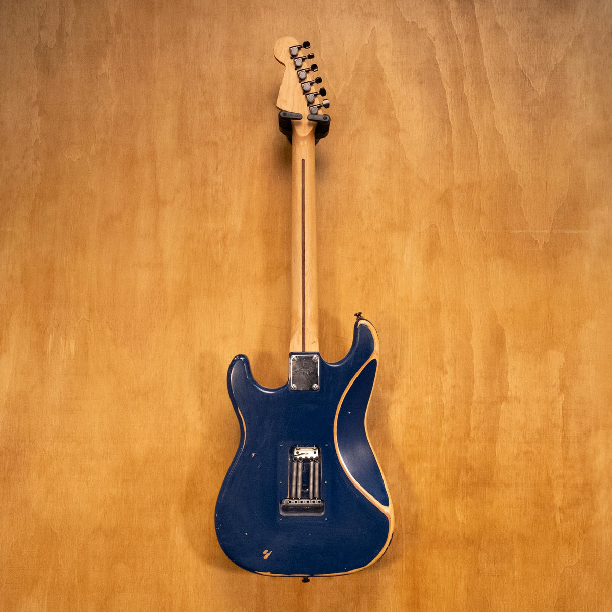 Reco Guitars S-Style electric guitar in blue, showcasing a sleek body, chrome hardware, and classic design, preowned and ready to play.