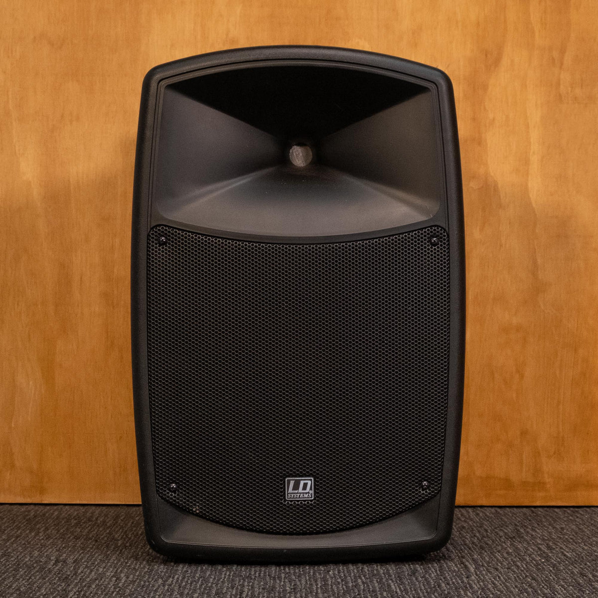 LD Systems Road Buddy 10 powered speaker, mains only, no battery, shown in an outdoor setting with controls and speaker grille visible.