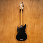 Fender JMJ Road Worn Mustang Bass Guitar in black with aged finish, four strings, and vintage-style hardware.
