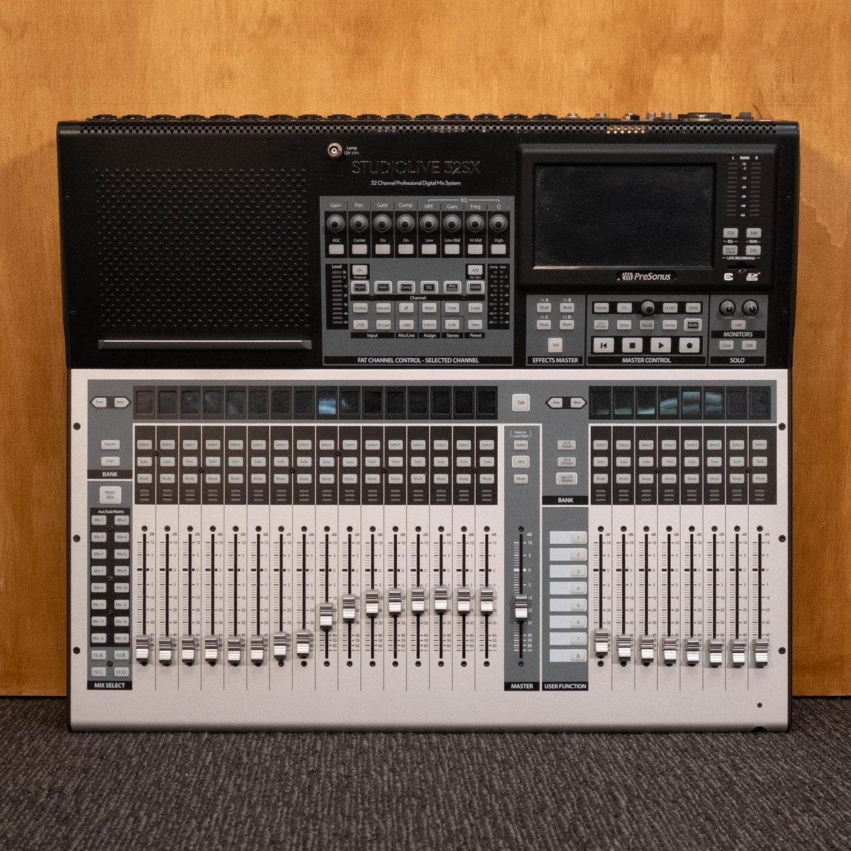 PreSonus StudioLive 32SX 32-channel digital mixer with multiple knobs and faders, professional audio interface for live sound and recording.