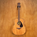 Yamaha FG800 acoustic guitar with natural wood finish, showing the body and fretboard in a close-up image.