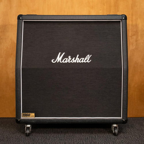 Marshall 1960A 4x12 guitar amplifier cabinet with vintage speaker grille and control panel, used condition, black finish.