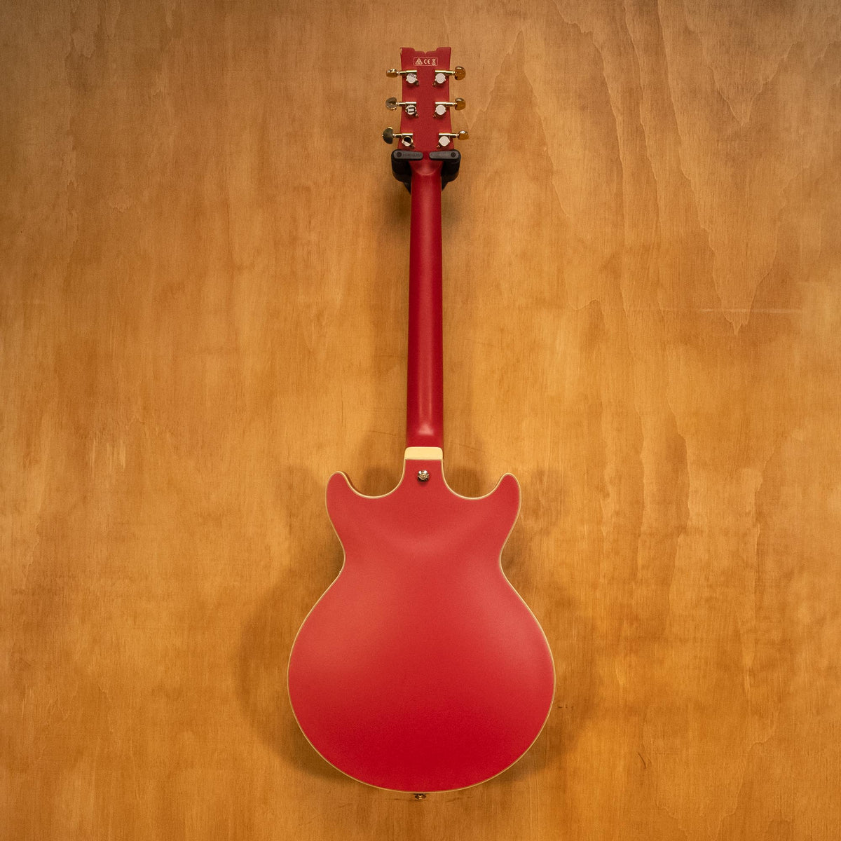 Ibanez AMH90 hollow body electric guitar in cherry red flat finish, displaying its sleek design and craftsmanship.