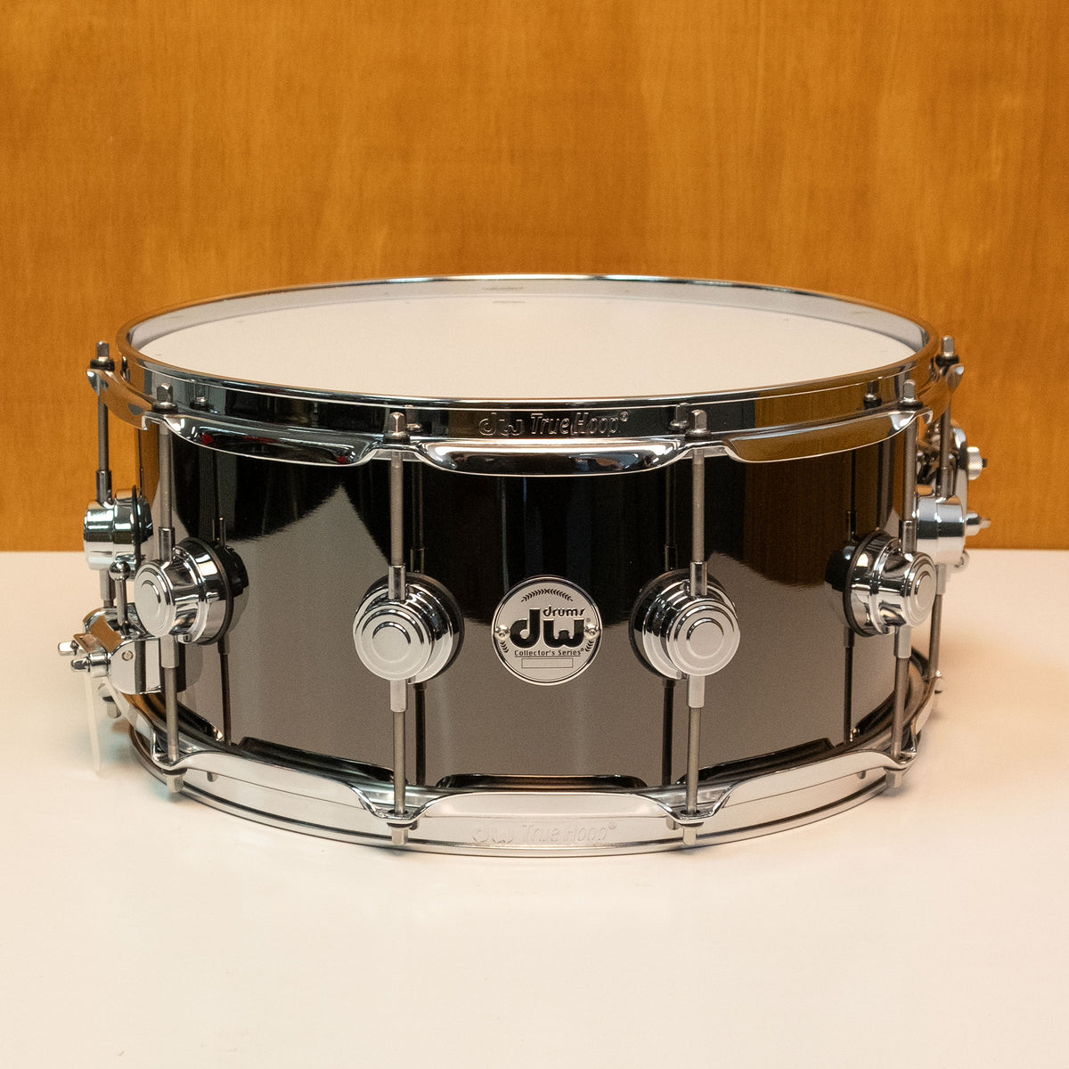 DW Collector's black nickel over brass snare drum, 14x6.5 inches, showcasing the drum's finish and detailed hardware.