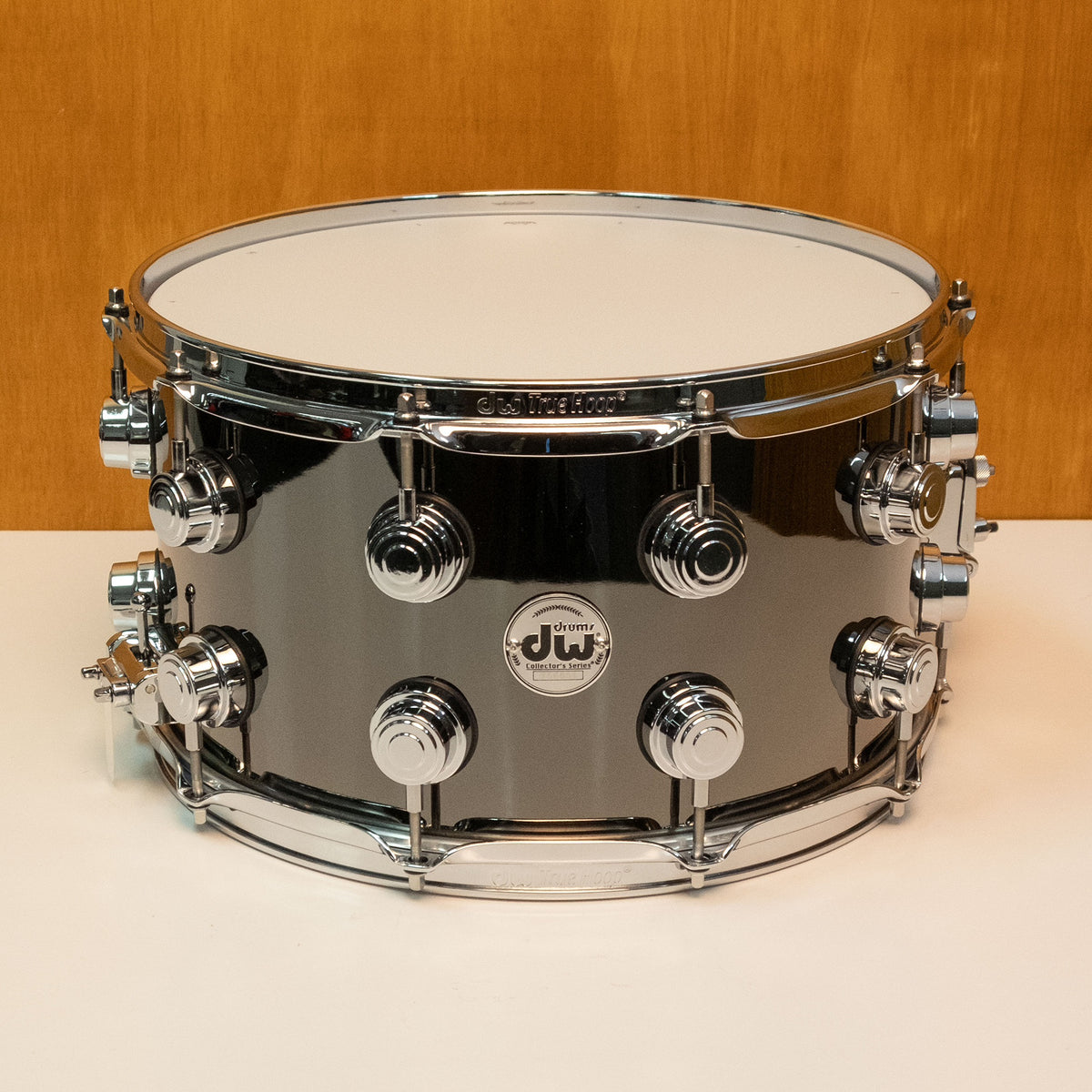 DW Collector's black nickel over brass snare drum, 14x8 inches, pre-owned, with detailed hardware and drum head visible.