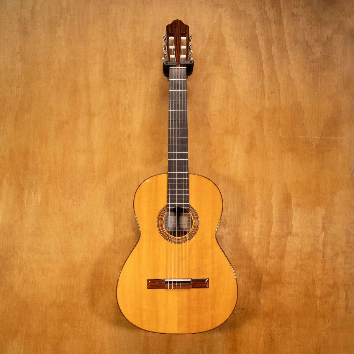 Preloved Esteve 4ST classical guitar with a polished wooden body and nylon strings, suitable for beginner and experienced players.