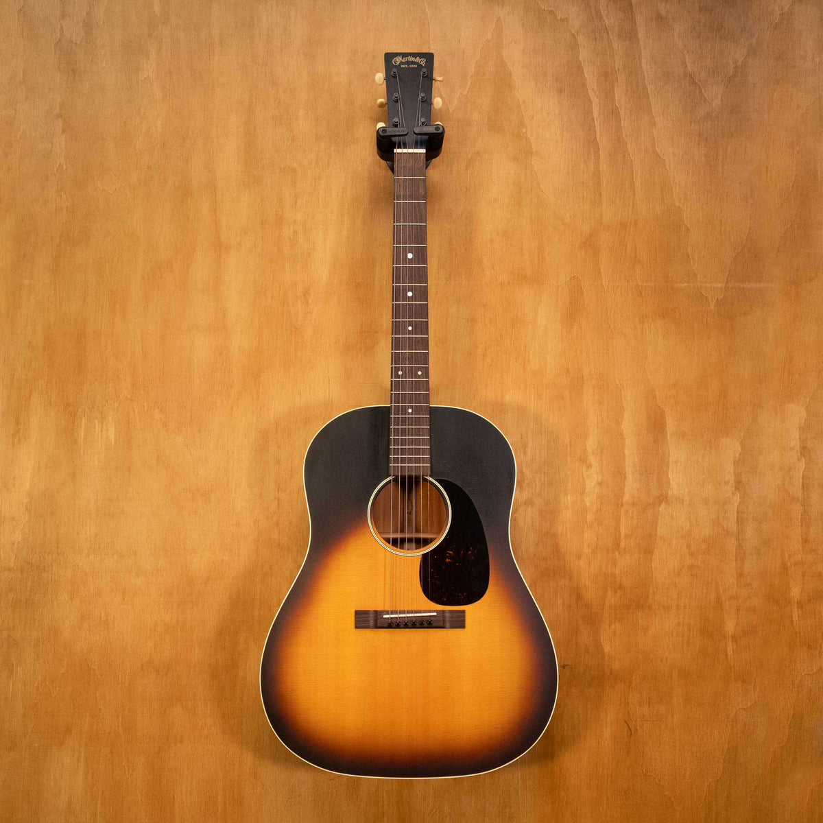Martin DSS-17 Whiskey Sunset acoustic guitar with a rich finish, featuring a dreadnought body and detailed wood grain.