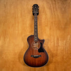 Preloved Taylor 362ce 12-string acoustic guitar with natural wood finish and cutaway body, showing the detailed fretboard and bridge.