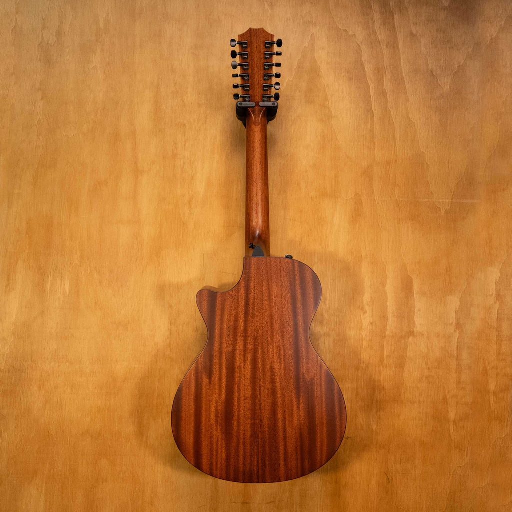 Taylor 362ce 12-string acoustic guitar, preowned, showing its rich wood finish and large body with detailed soundhole rosette.