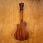 Taylor 362ce 12-string acoustic guitar, preowned, showing its rich wood finish and large body with detailed soundhole rosette.
