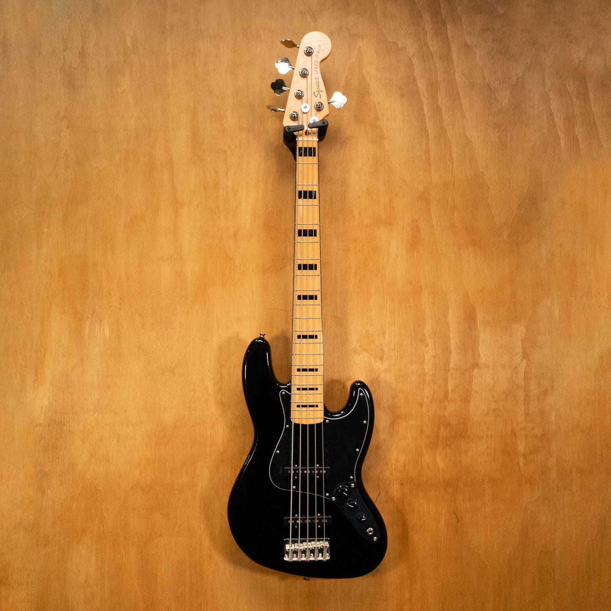 Preloved Squier ClassicVibe '70s 5-string Jazz Bass Guitar, showcasing the sunburst finish, maple neck, and four-string body with pickups.