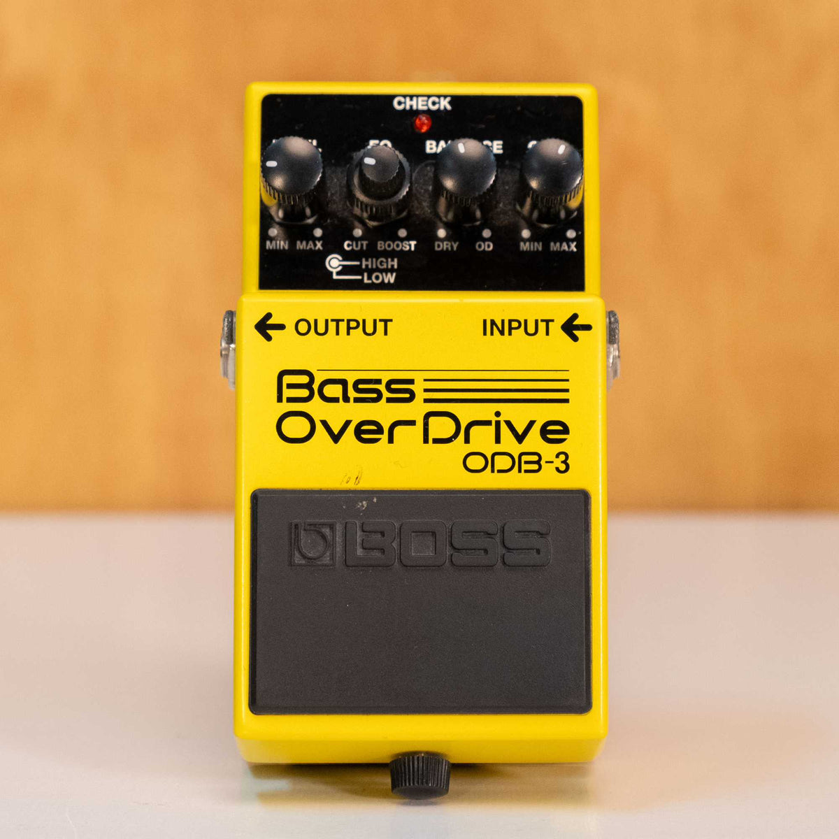 BOSS ODB-3 Bass Overdrive guitar effects pedal with control knobs and input/output jacks on a pedalboard.