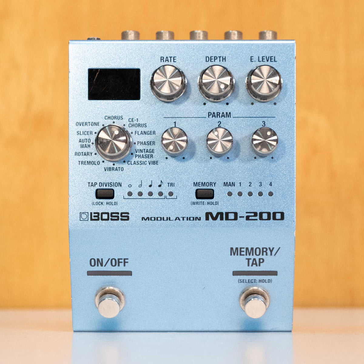 BOSS MD-200 modulation guitar effects pedal with control knobs and input/output jacks, shown from the front view.