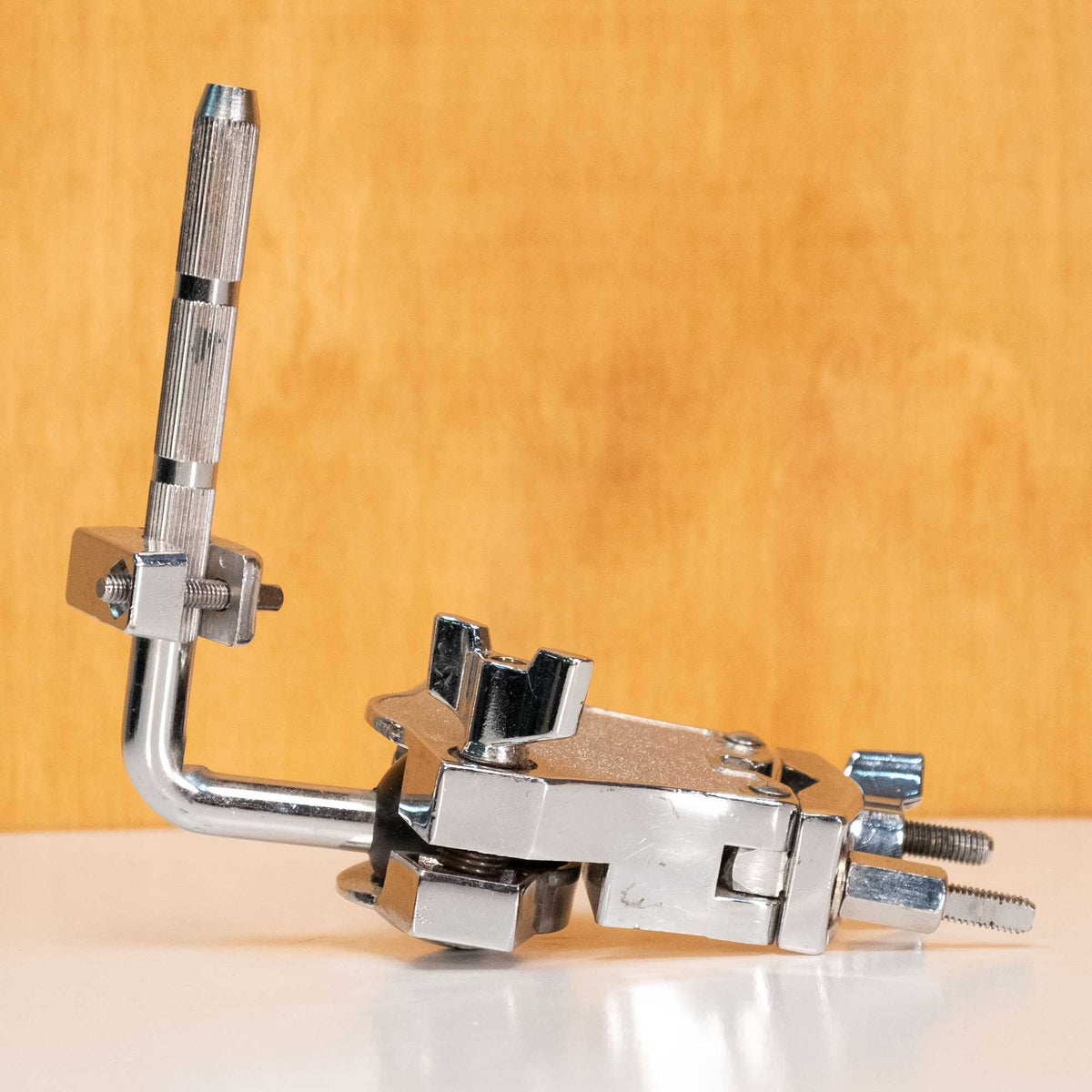 Gibraltar Tom Arm Clamp SC-SLRM2492 for 10.5mm drum hardware shaft, shown in a close-up with metal construction and adjustable grip.
