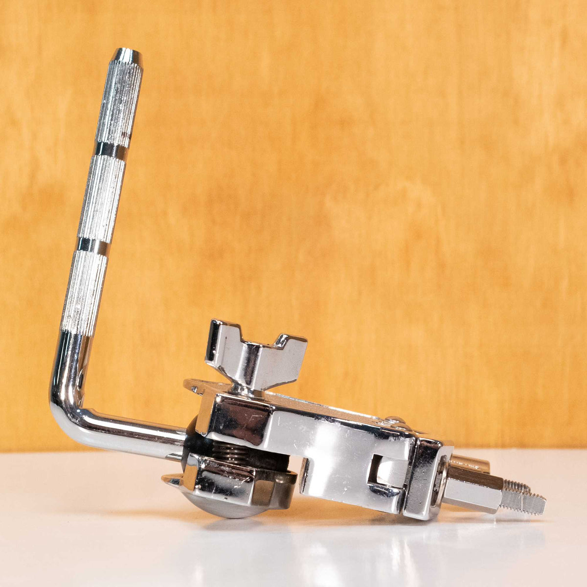 Gibraltar Tom Arm Clamp with 10.5mm shaft, drum hardware accessory, shown attached to drum kit in a close-up view