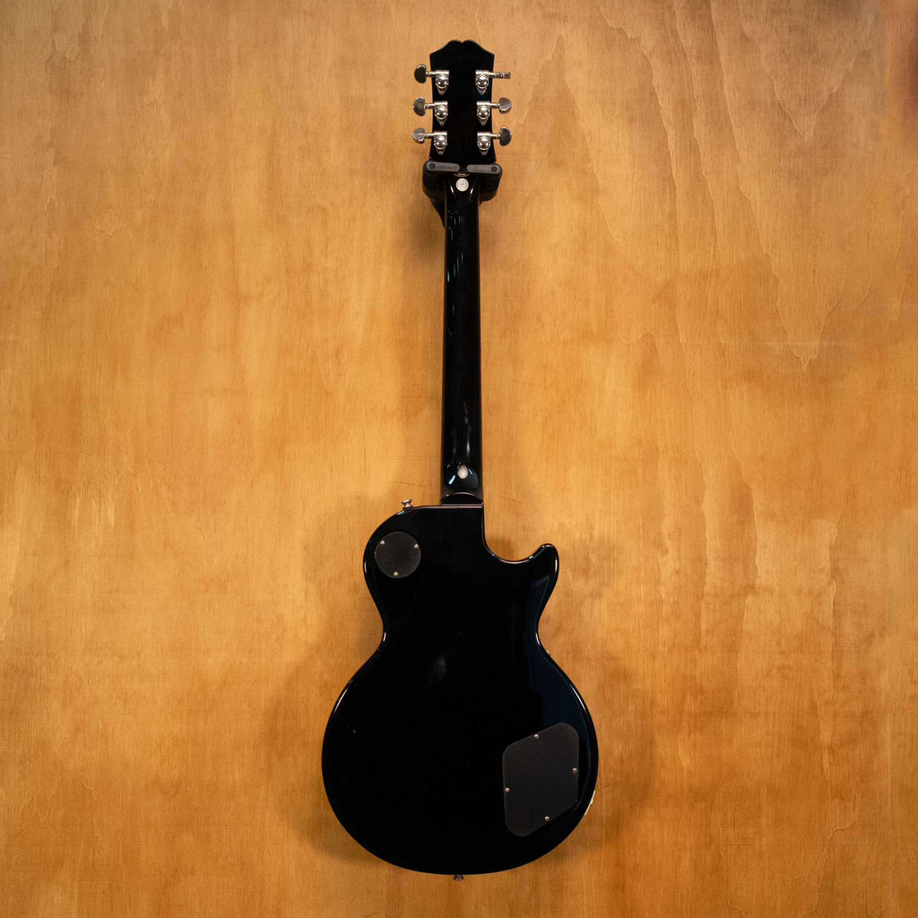 Left-handed Epiphone Les Paul electric guitar in ebony finish, showing the body, neck, and hardware details.
