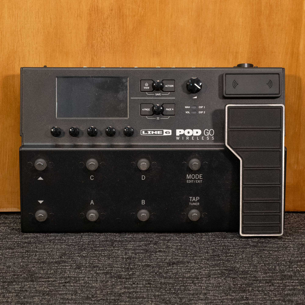 Line 6 POD Go Wireless multi-effect pedal with transmitter, compact guitar effects processor, black with control knobs and display.