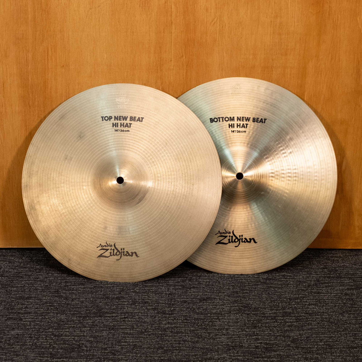 Zildjian 14-inch New Beat Hi-Hat Cymbals pair from the '90s, showing the textured surface and shiny finish in a close-up shot.