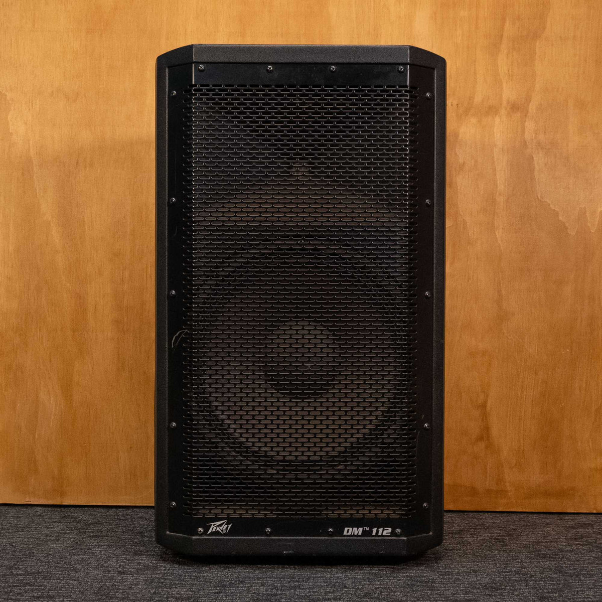 Peavey DM112 powered speaker, black acoustic speaker with control panel, used, in good condition, suitable for live sound reinforcement.
