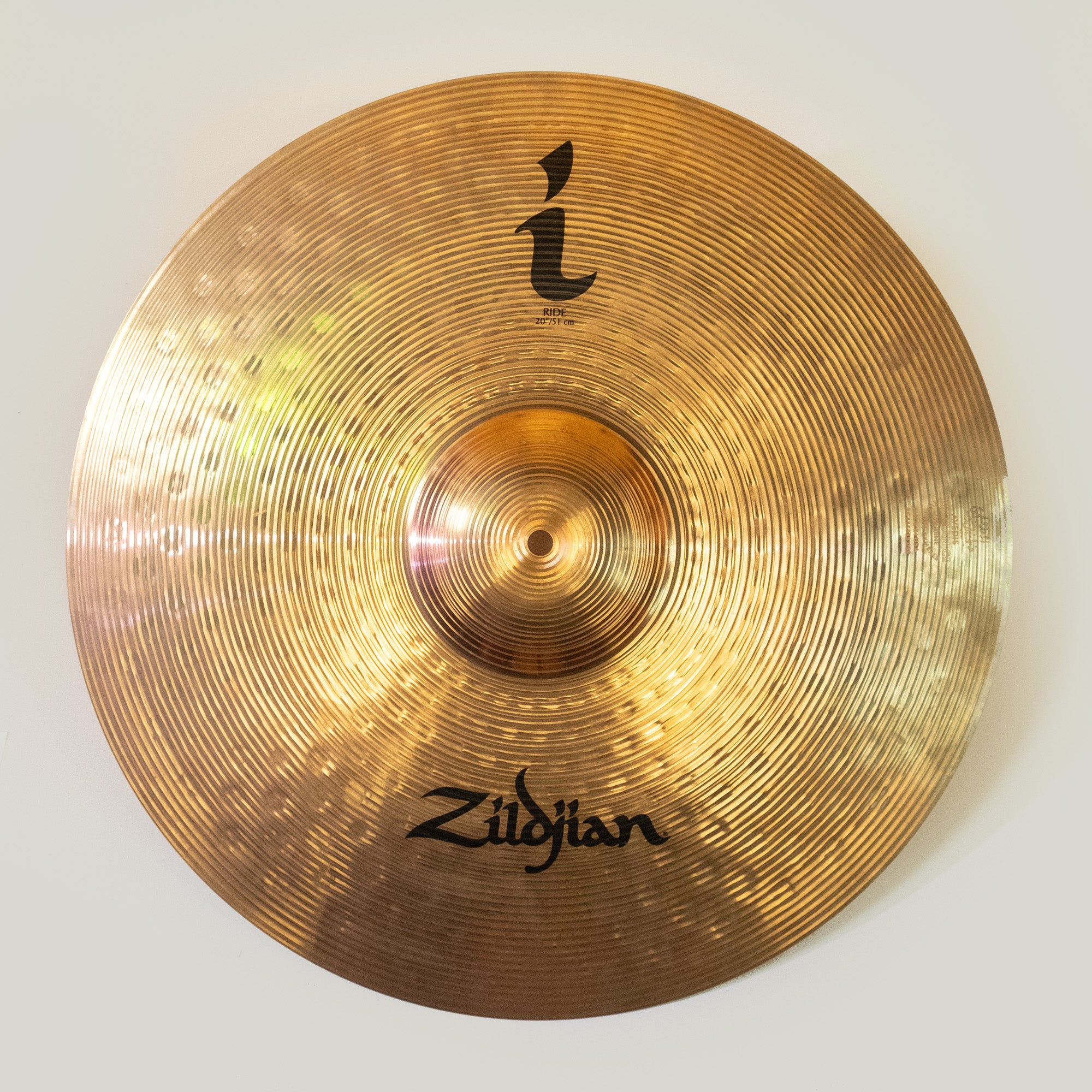 Zildjian I 20 inch ride cymbal, gently used, showcasing its shiny surface and classic shape for drummers.